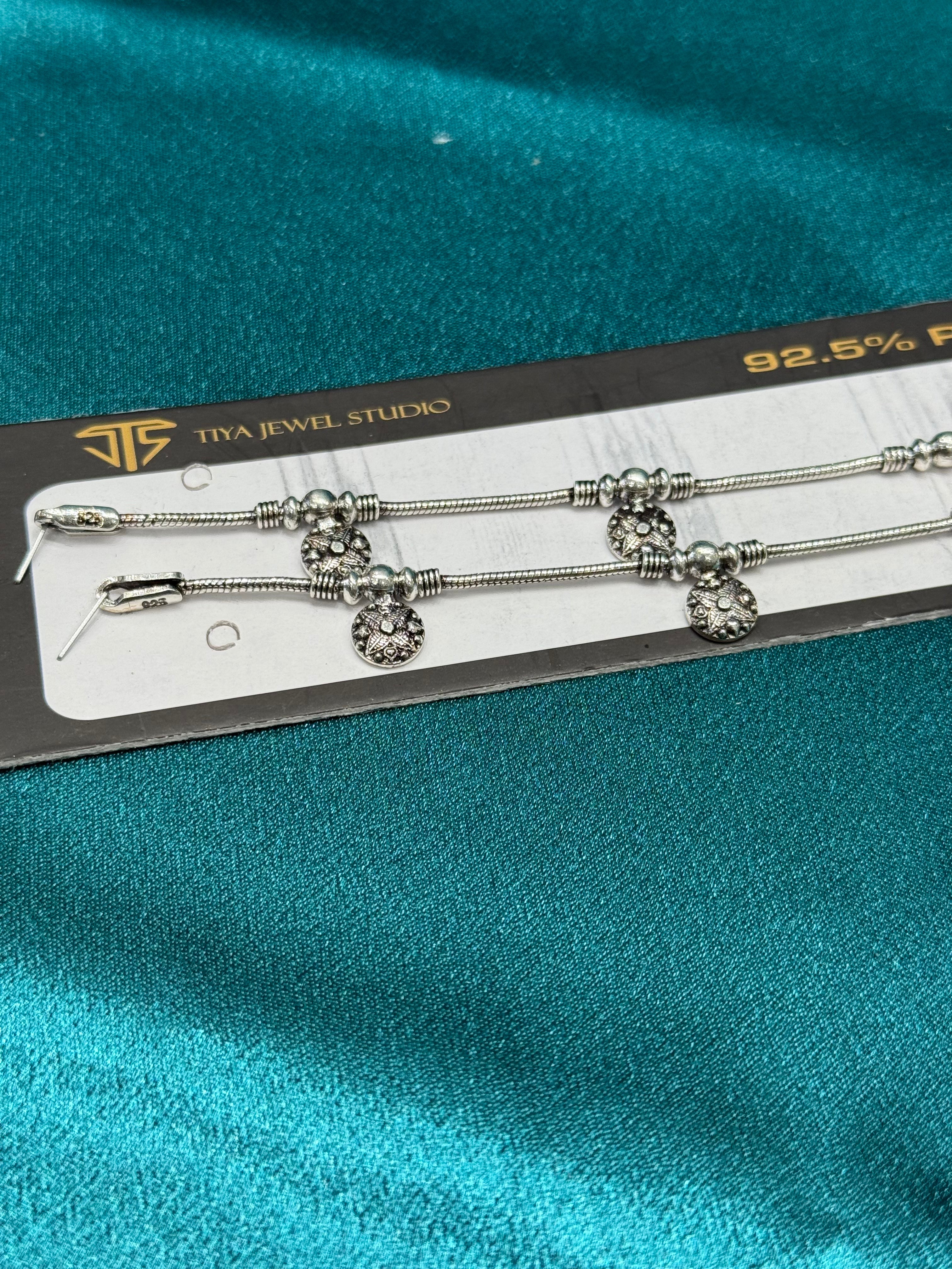 Fancy silver anklet in antique finish with beads and charms