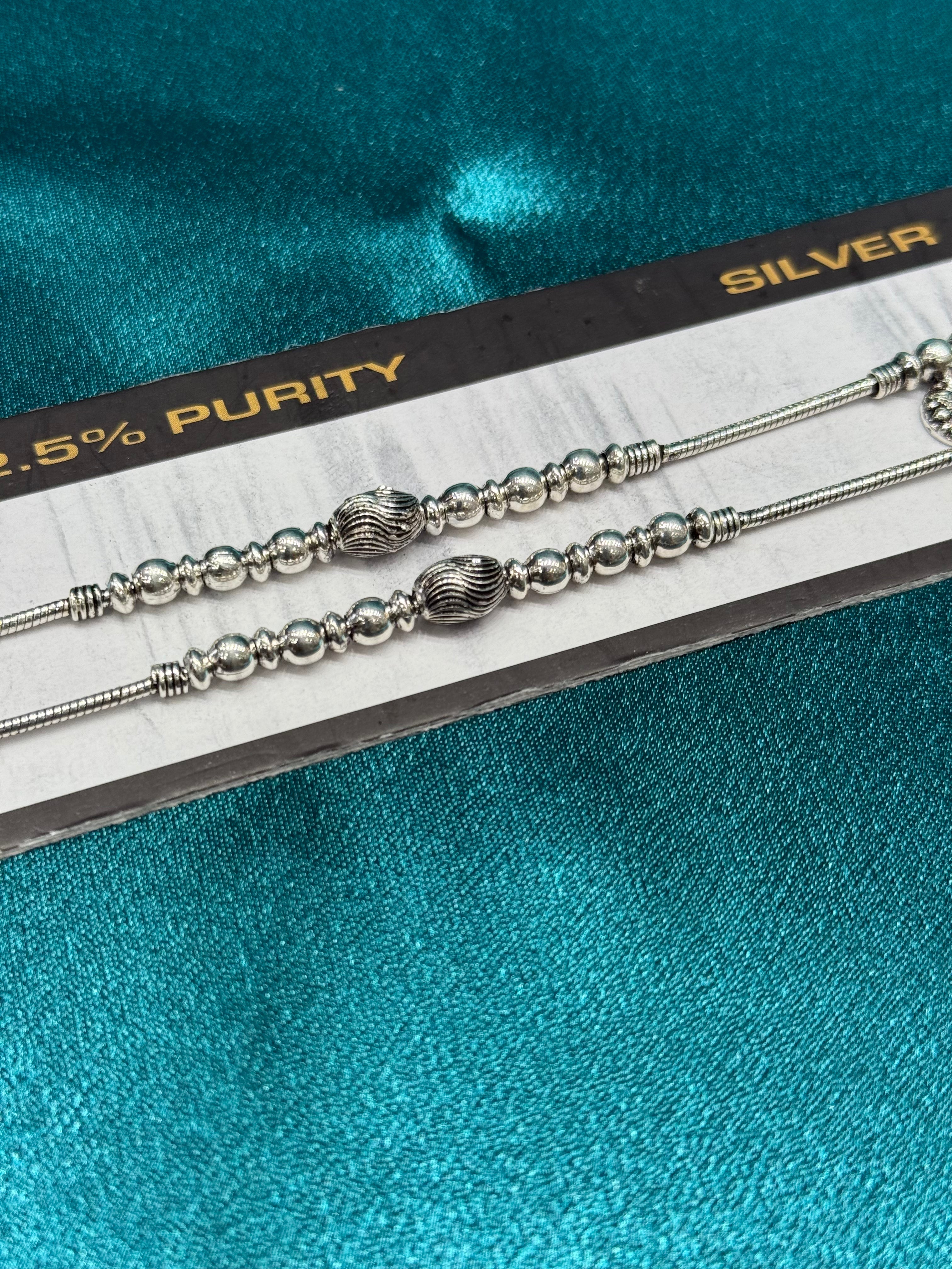 Fancy silver anklet in antique finish with beads and charms