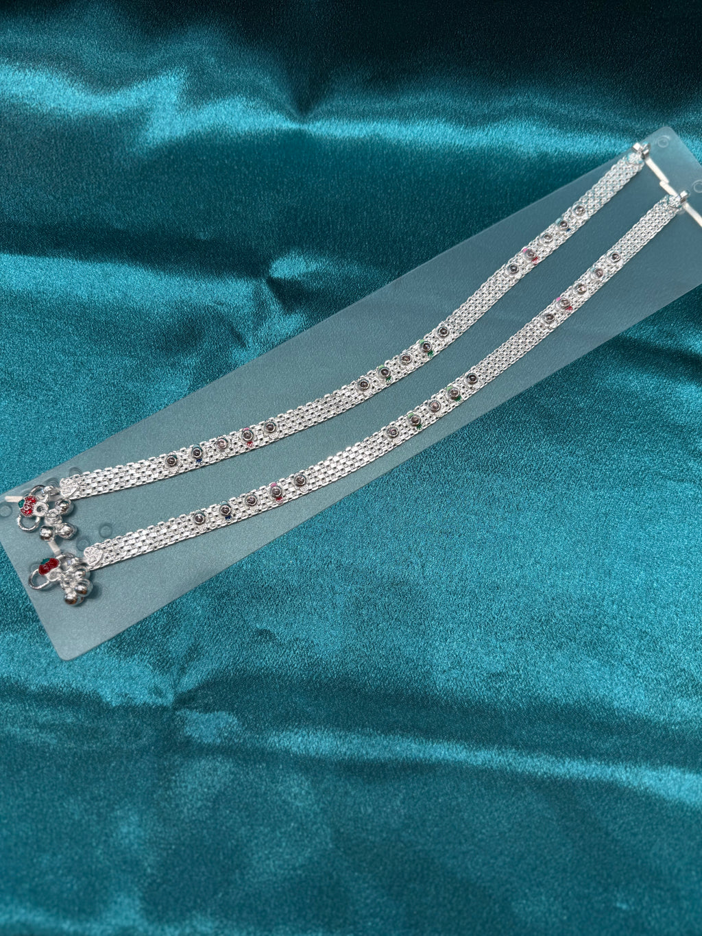 Traditional silver anklet with floral pattern and stones