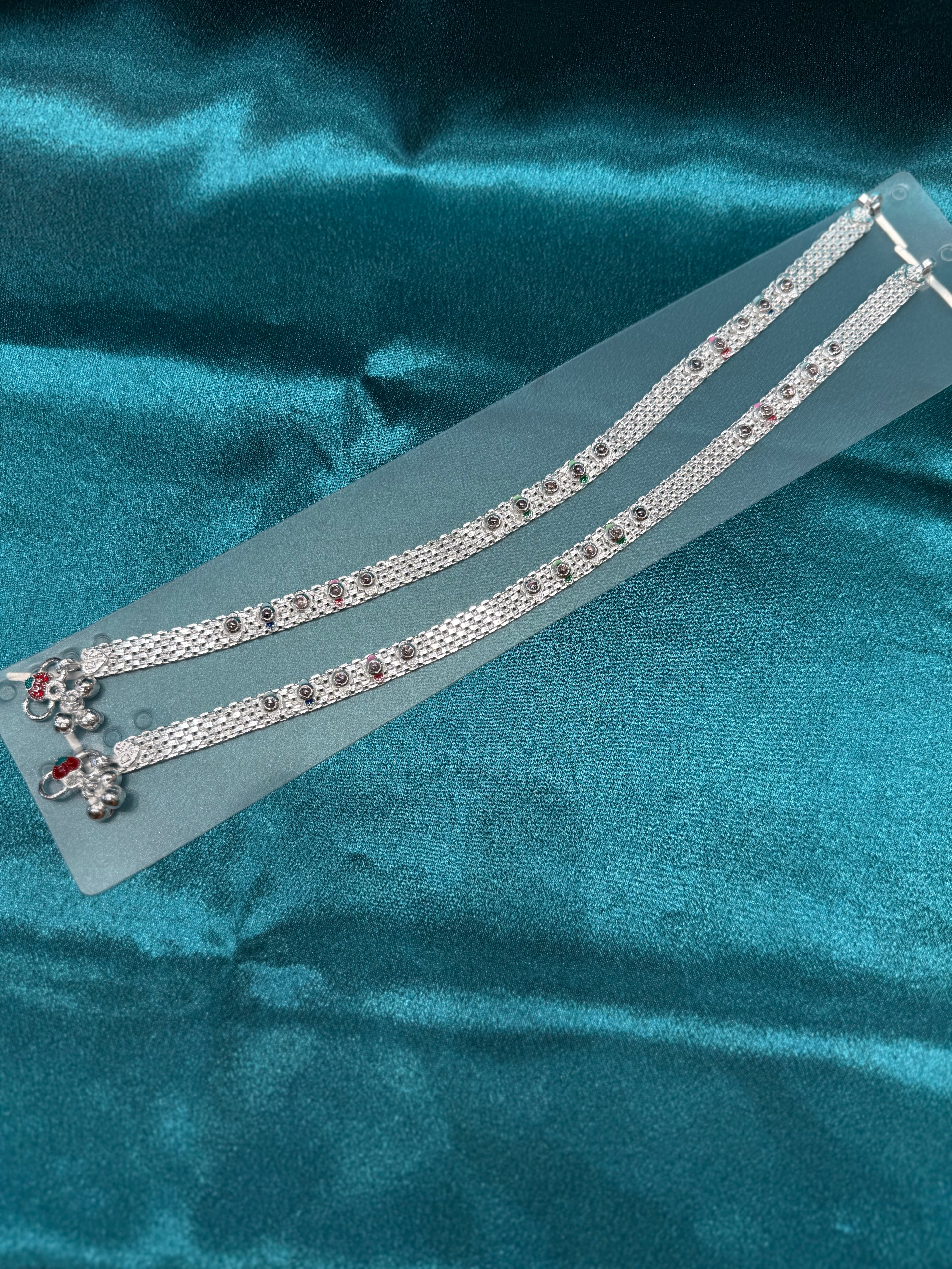 Traditional silver anklet with floral pattern and stones