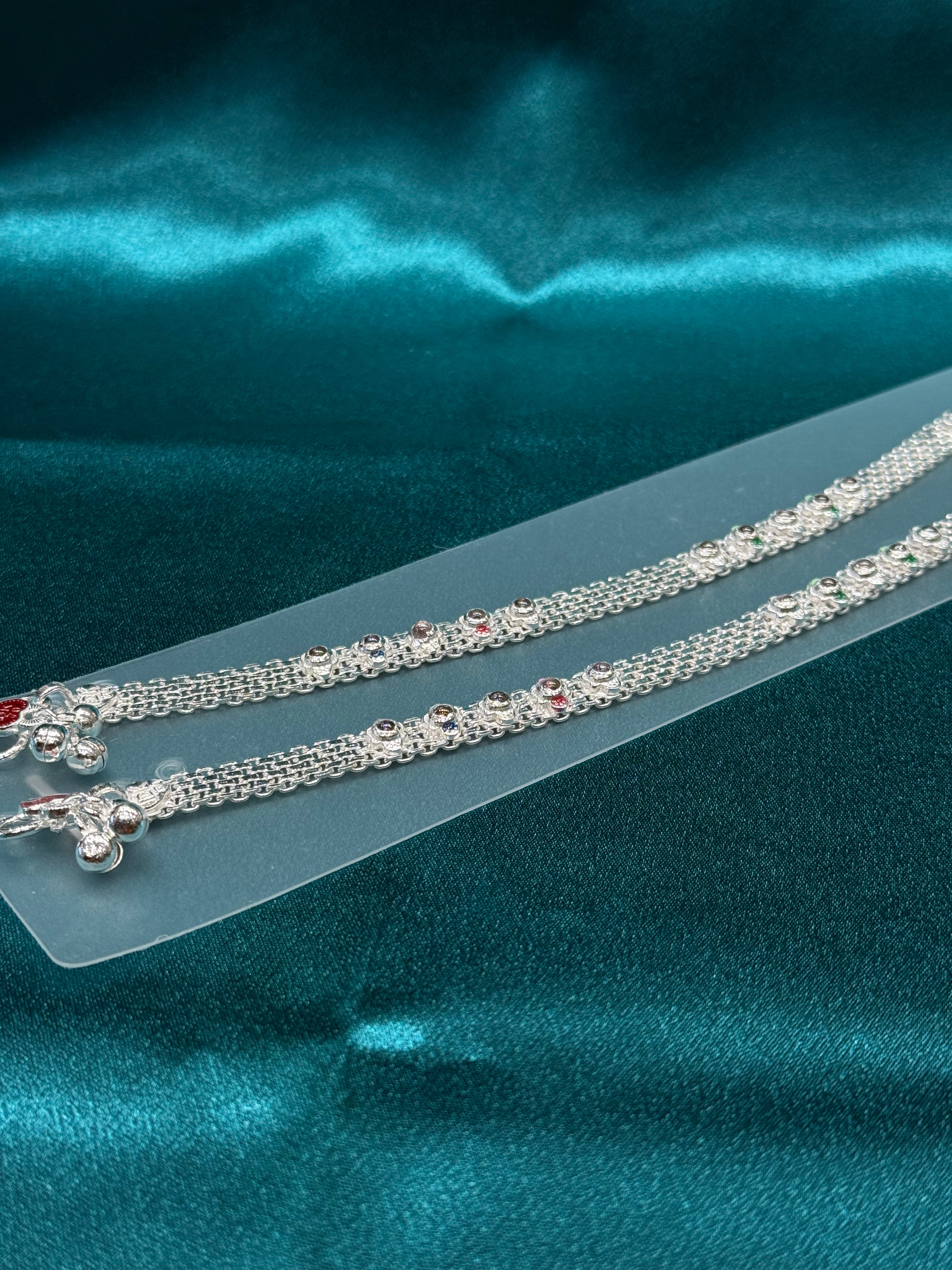 Traditional silver anklet with floral pattern and stones
