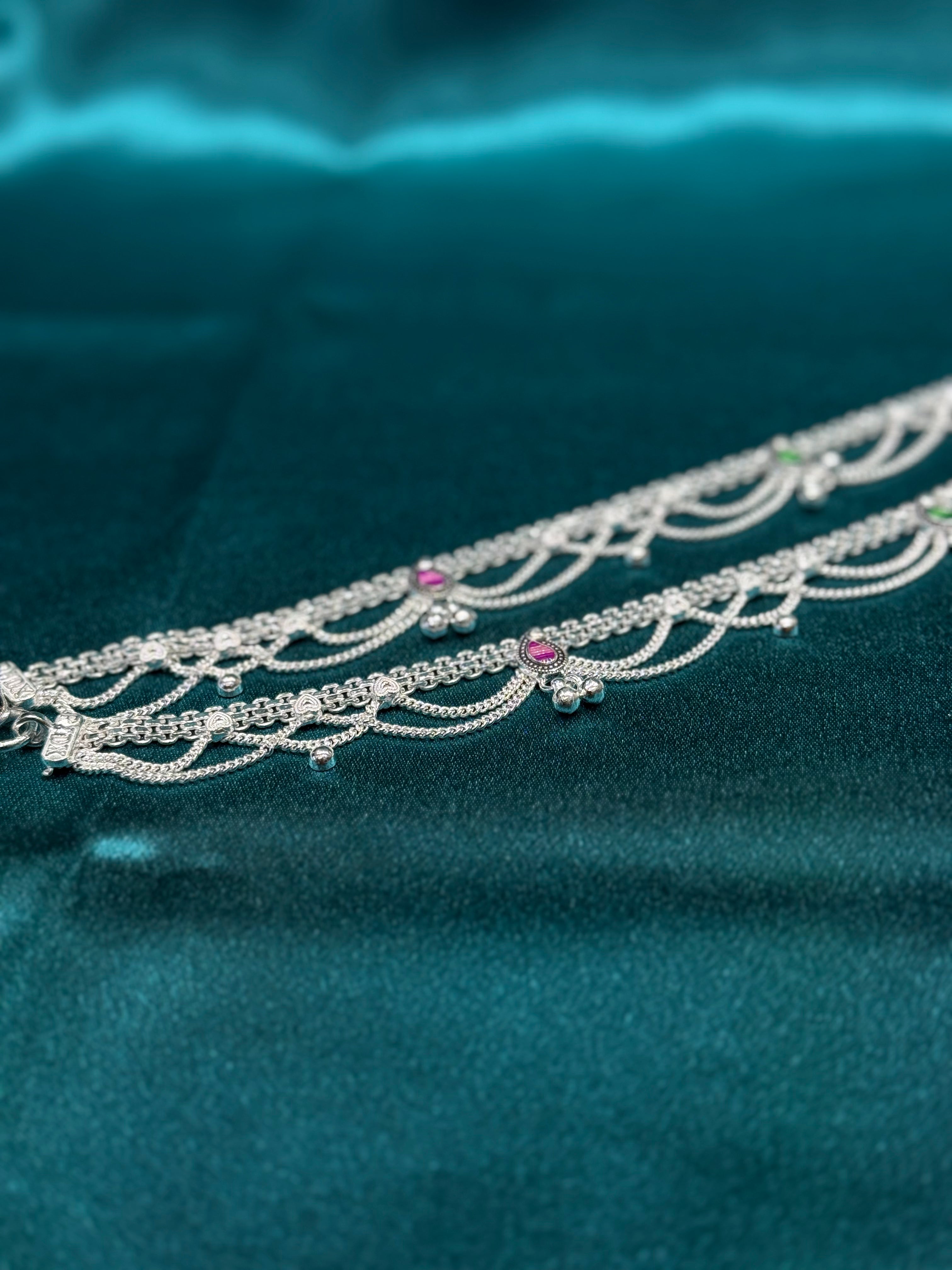 Traditional silver anklet with frill hanging and green and pink pattern