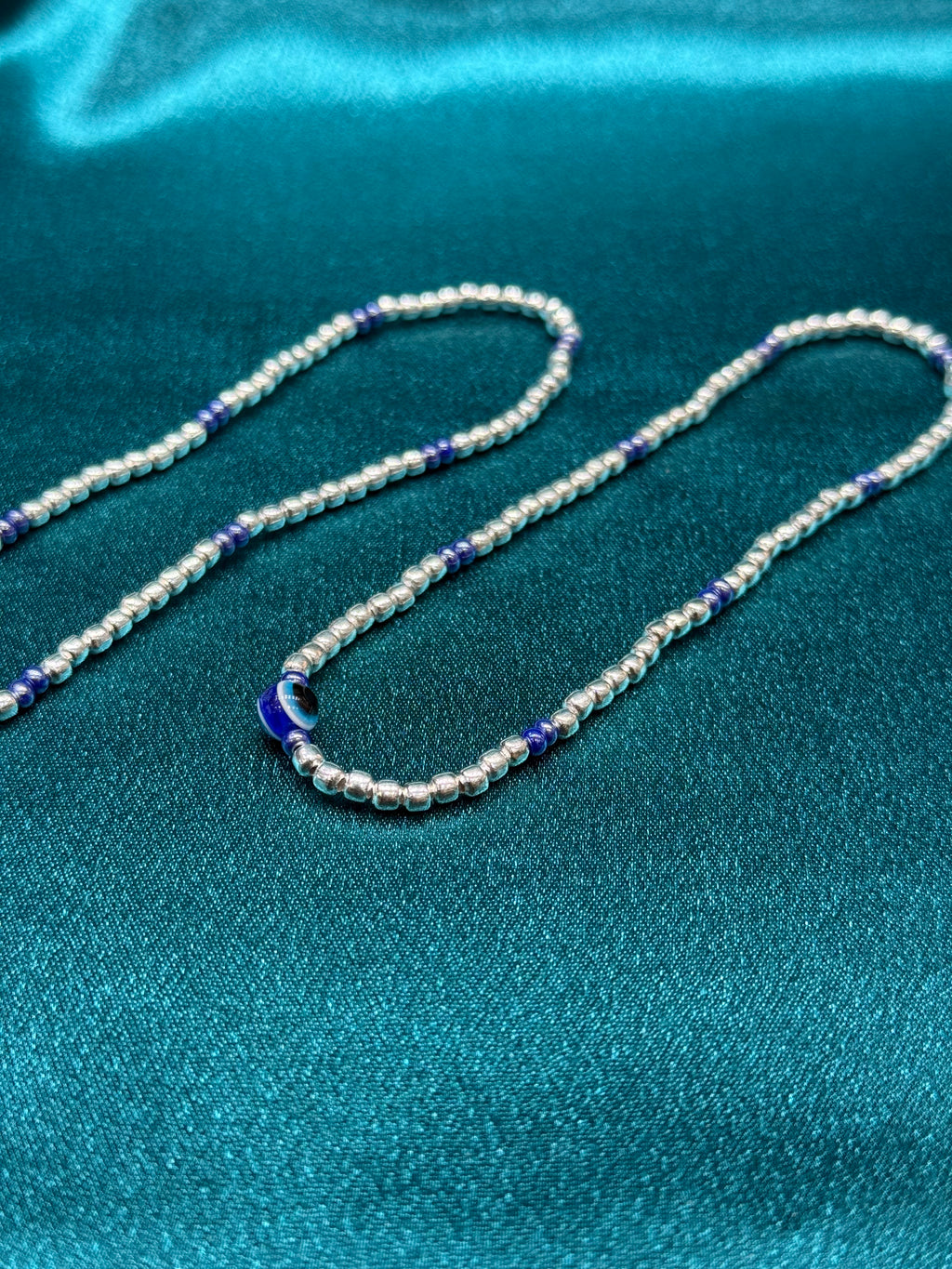 Fancy silver anklet with evil eye beads