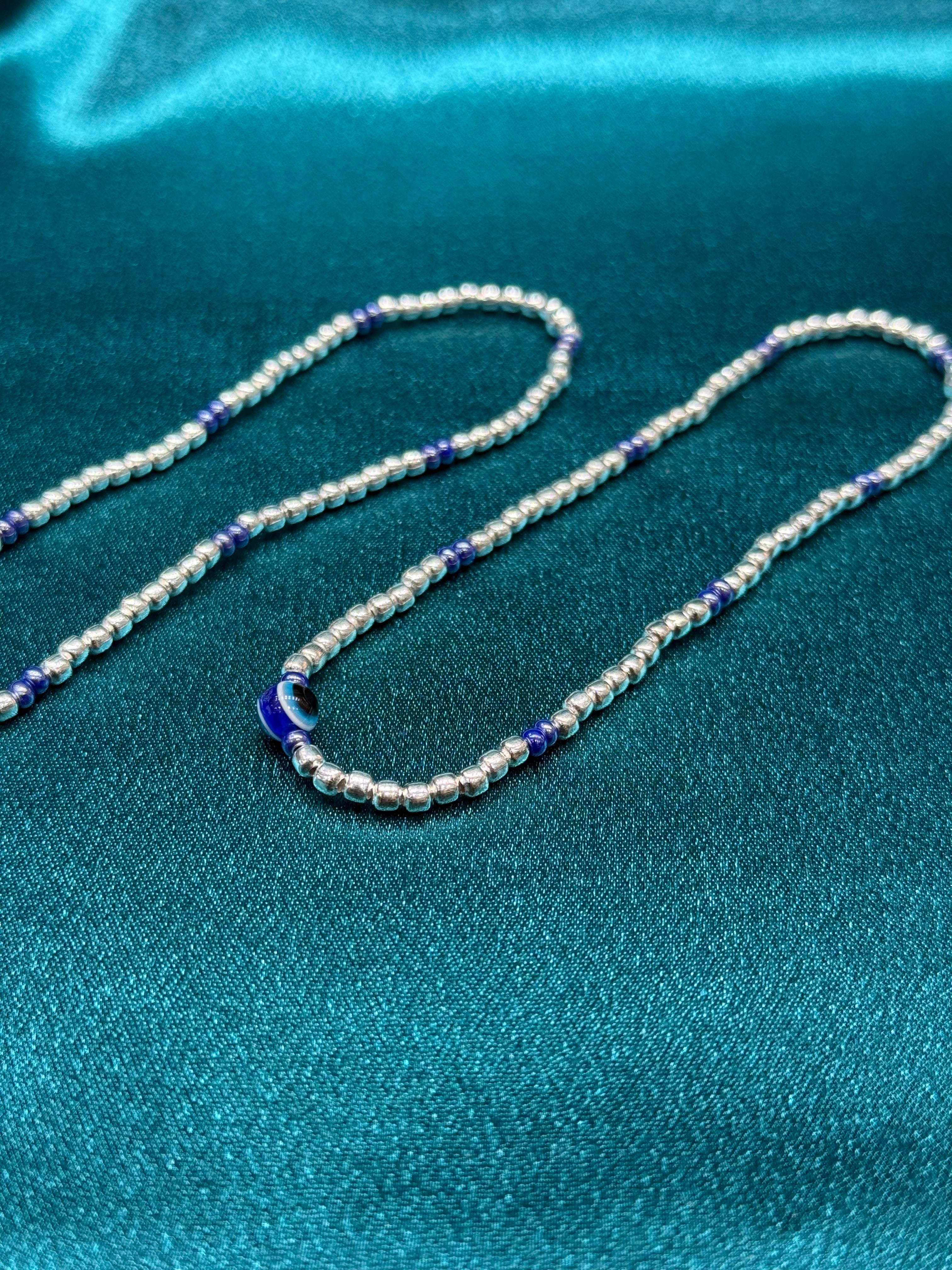 Fancy silver anklet with evil eye beads