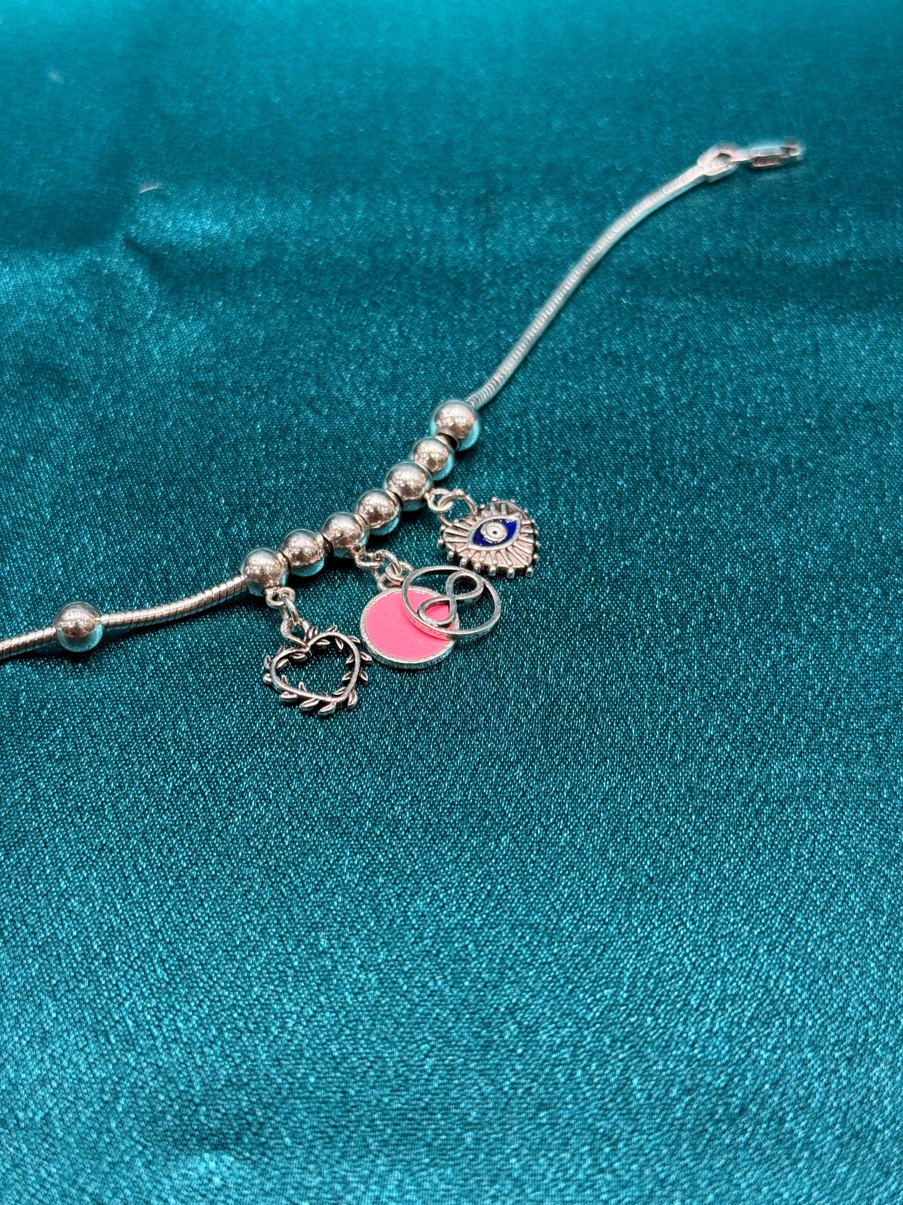Single fancy silver anklet with Heart, Infinity and evil eye hanging charm