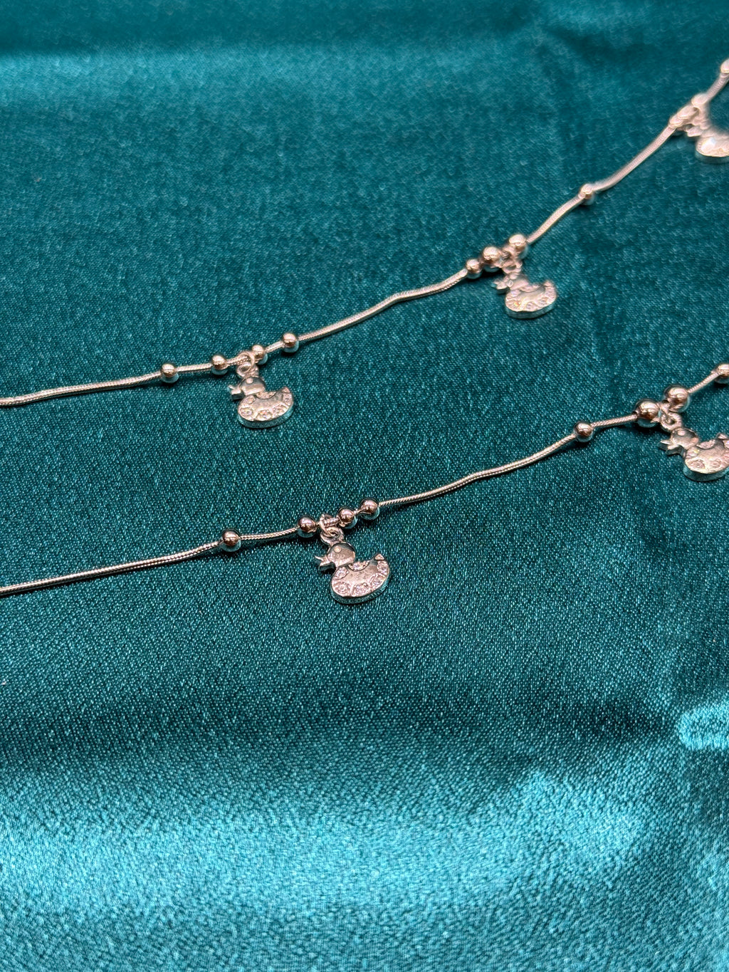 Fancy silver anklet with duck hanging charms