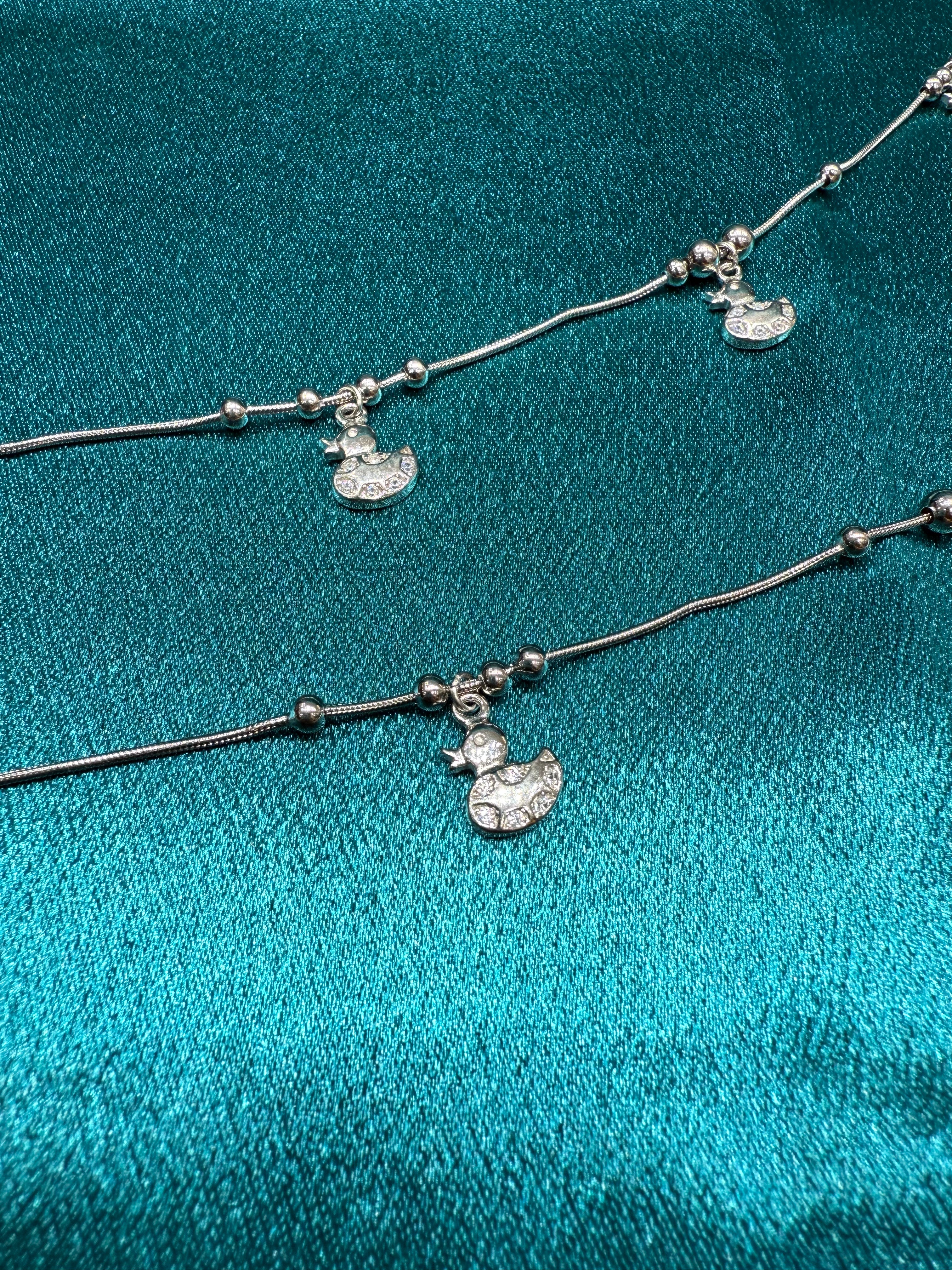 Fancy silver anklet with duck hanging charms