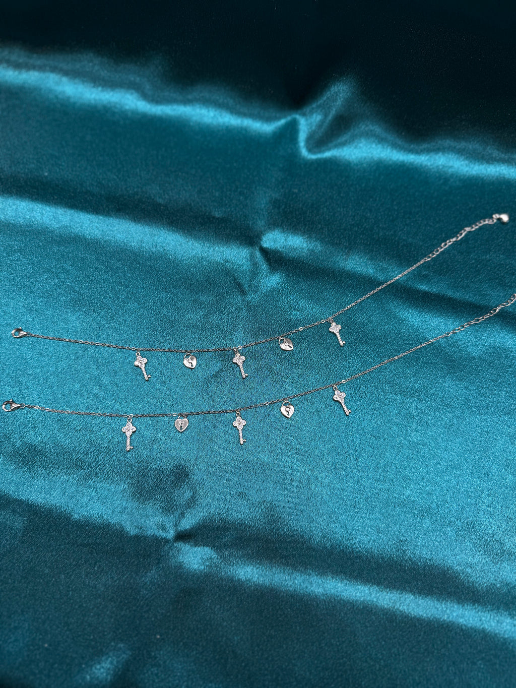 Fancy silver anklet with key and lock hanging beads