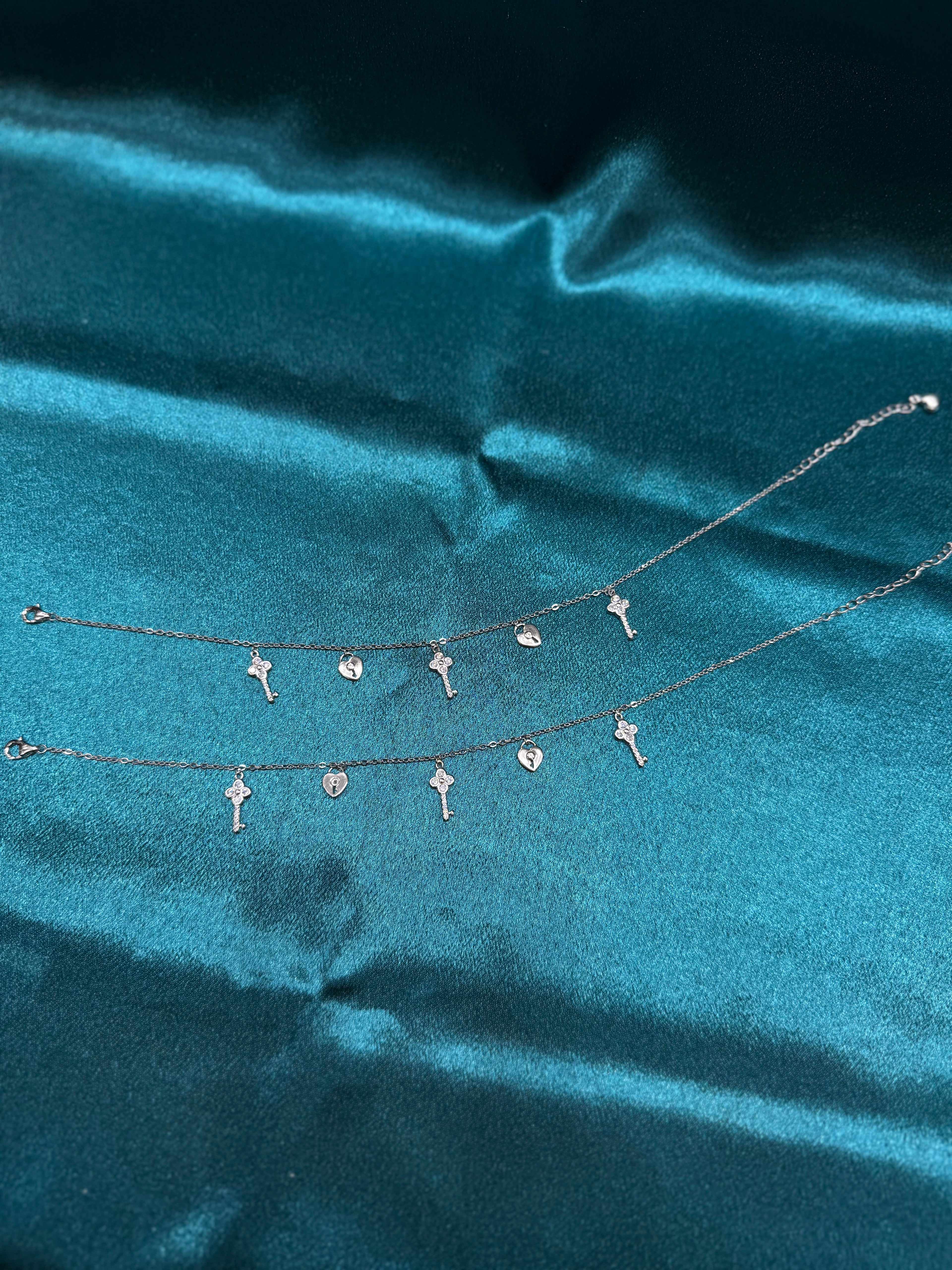 Fancy silver anklet with key and lock hanging beads