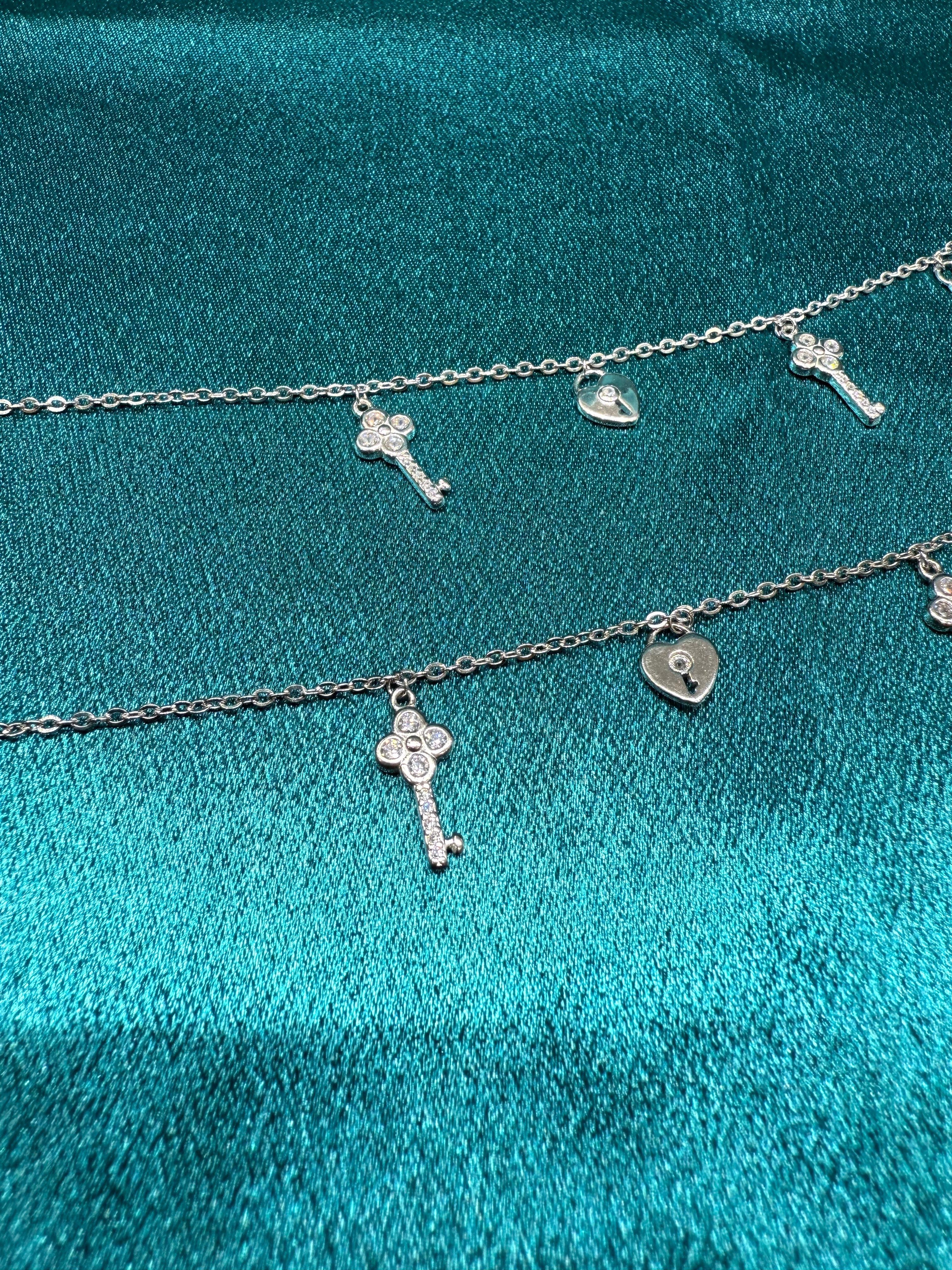 Fancy silver anklet with key and lock hanging beads