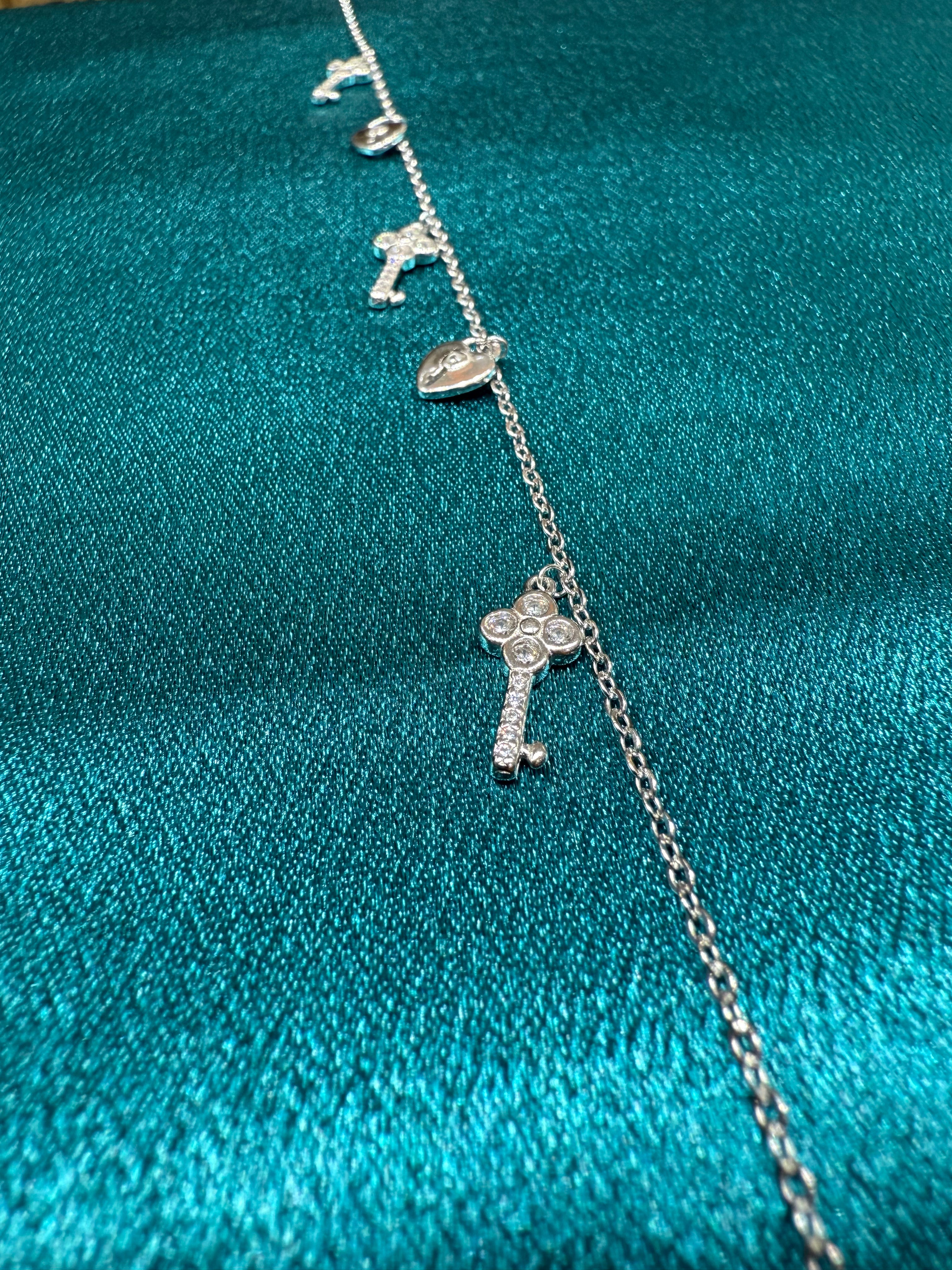 Fancy silver anklet with key and lock hanging beads