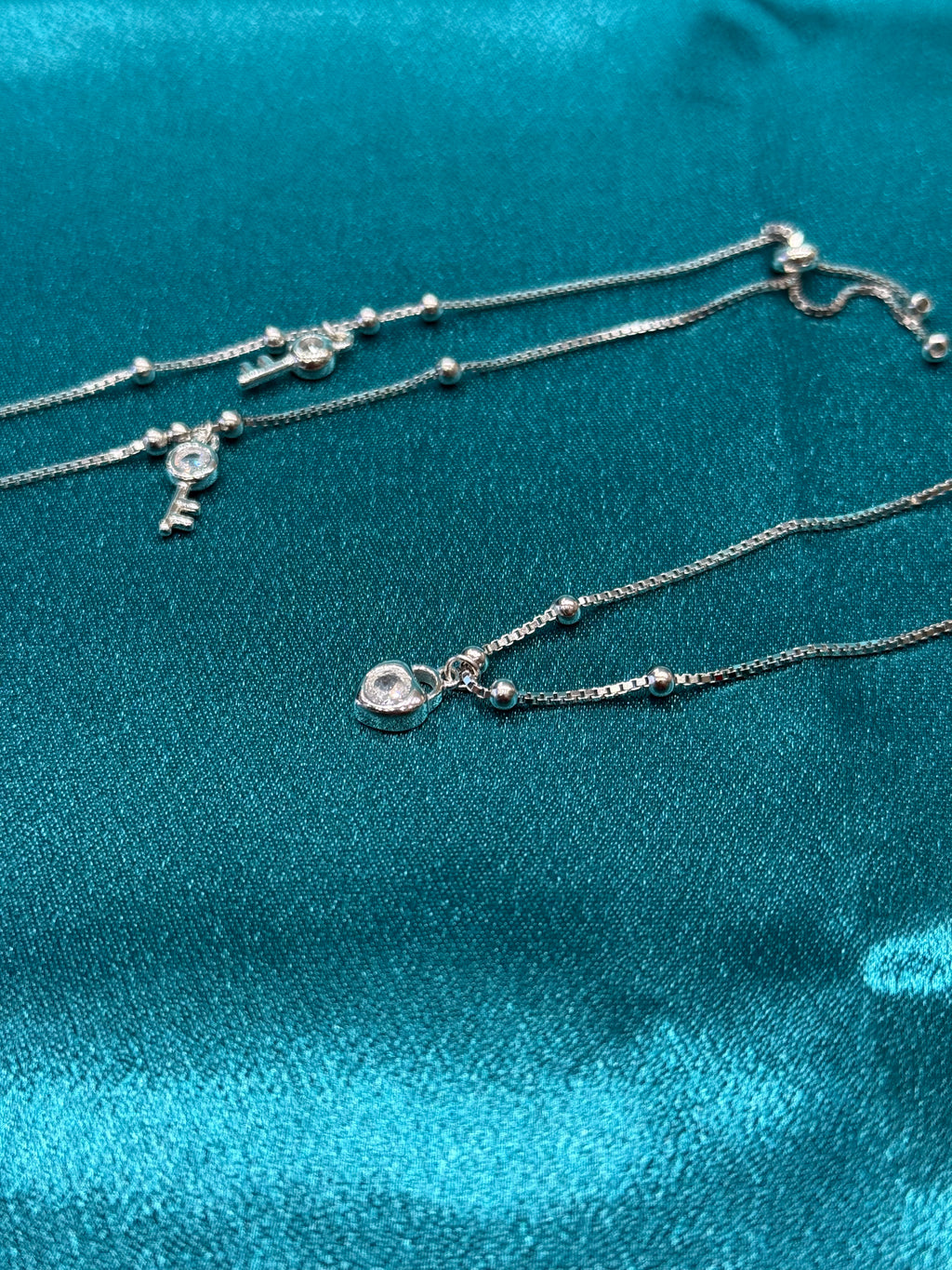 Fancy silver anklet with key and lock stone hanging