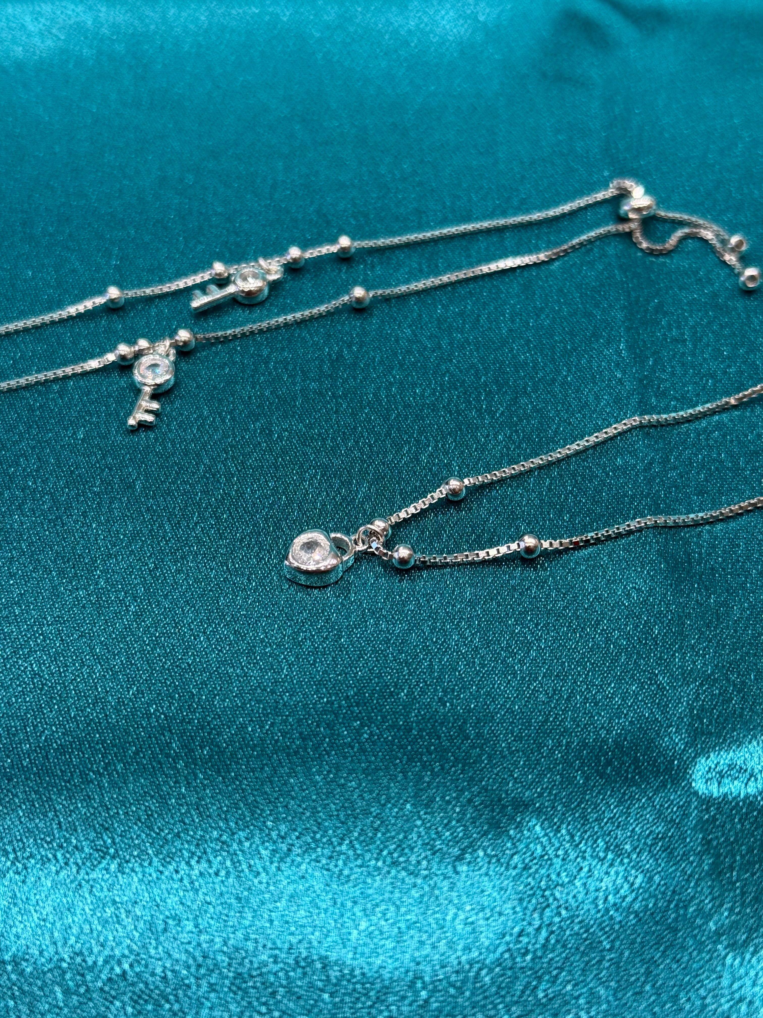 Fancy silver anklet with key and lock stone hanging