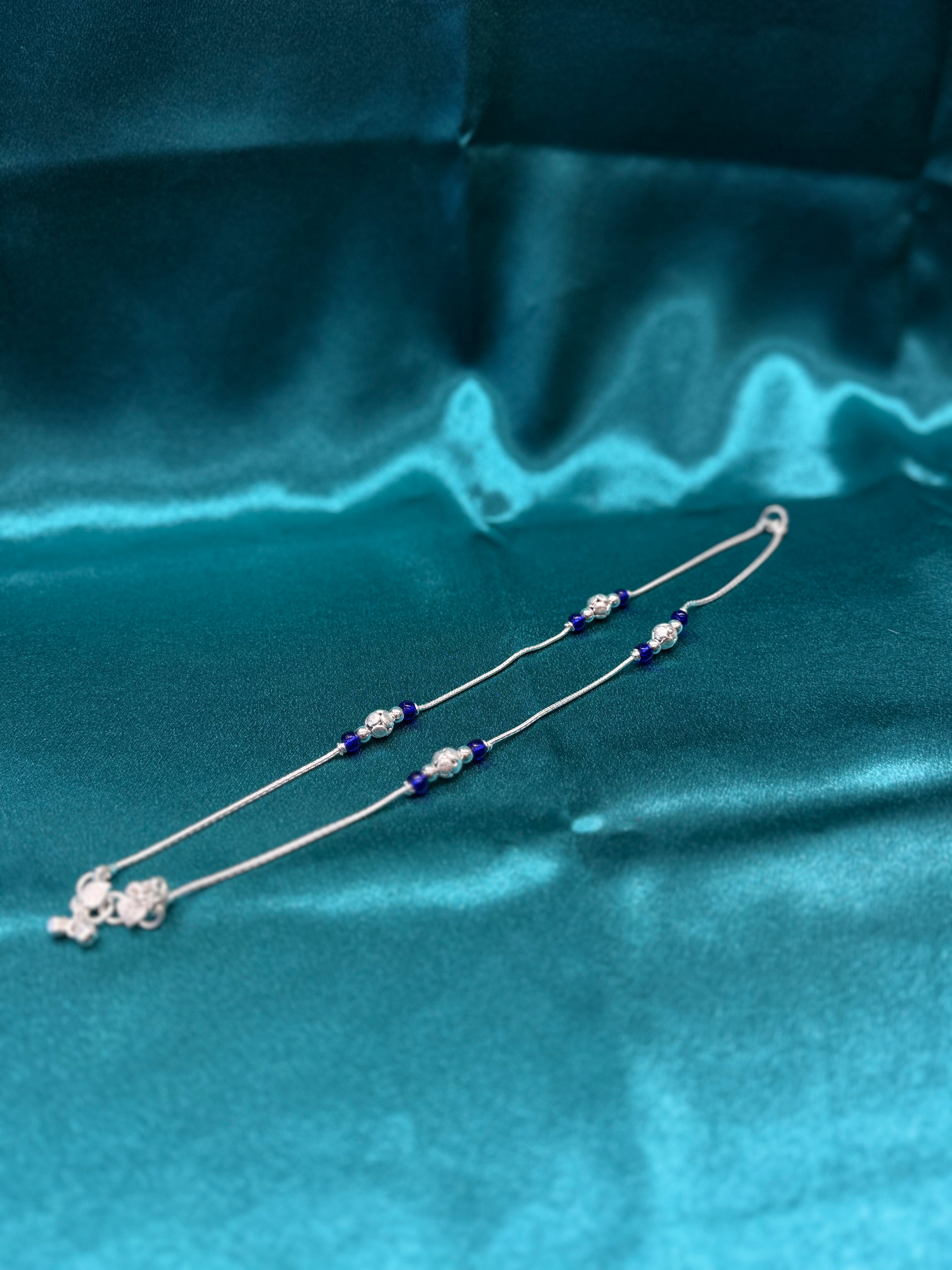 Fancy silver anklet with blue and silver round beads