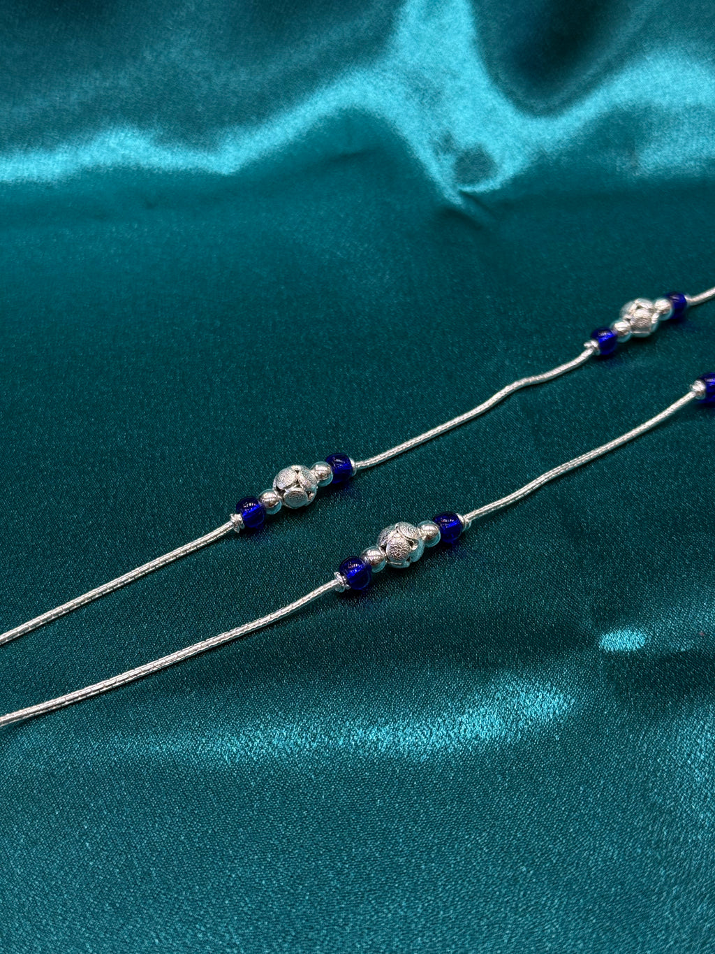 Fancy silver anklet with blue and silver round beads