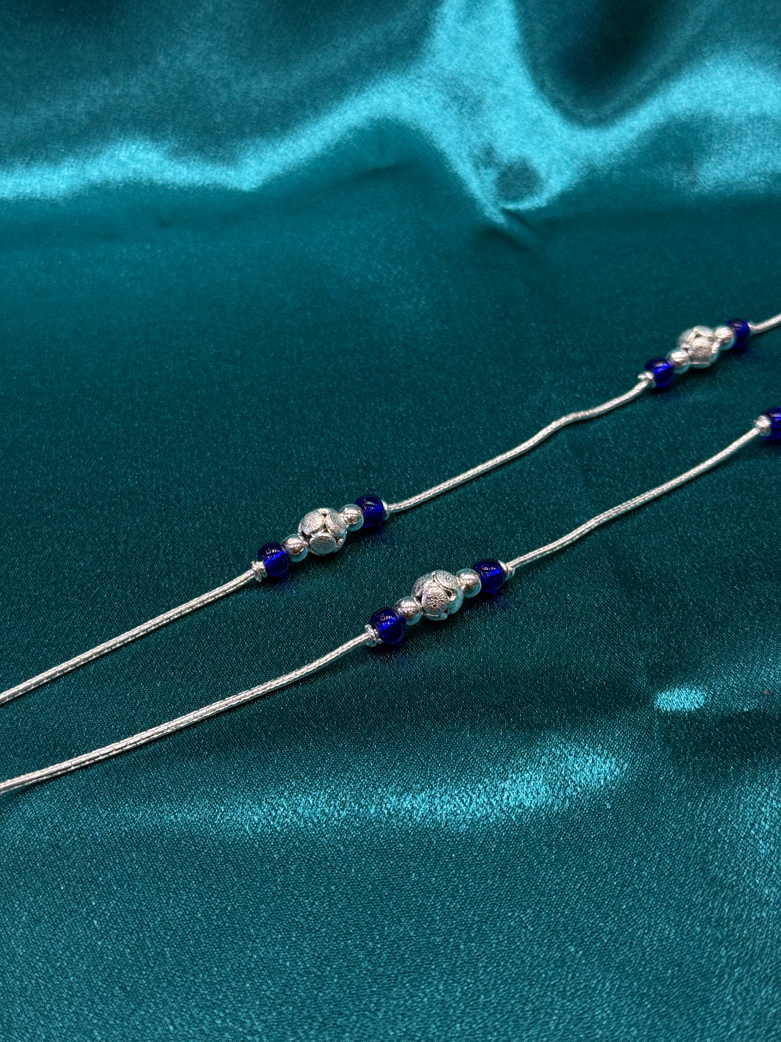 Fancy silver anklet with blue and silver round beads