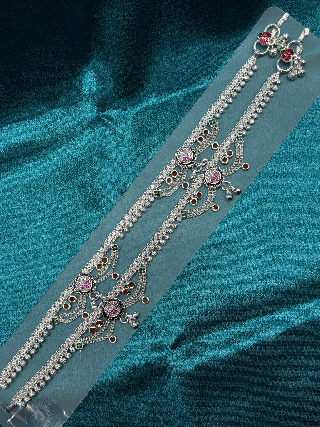 Traditional silver anklet with pink and orange stones and hanging bells