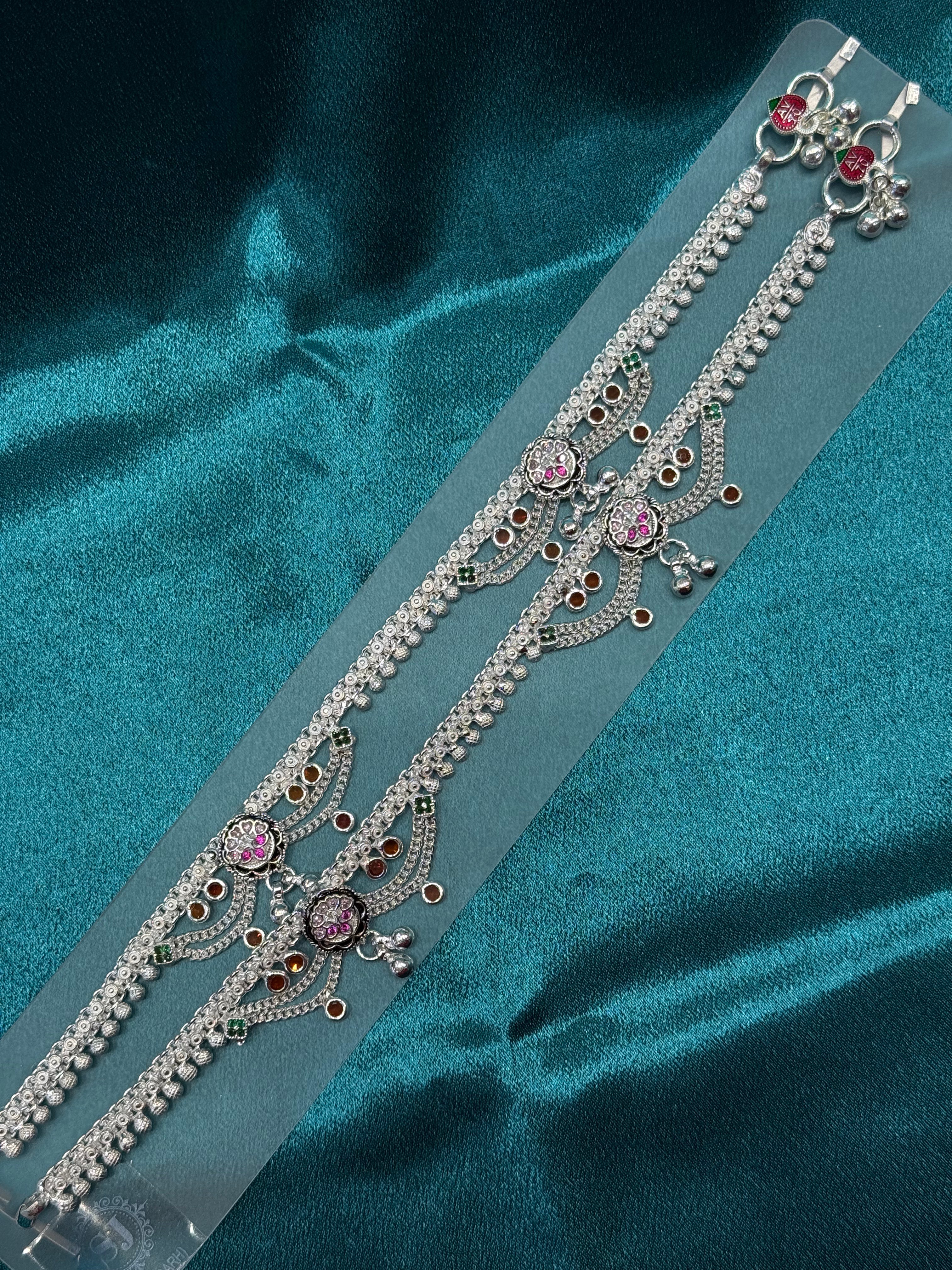 Traditional silver anklet with pink and orange stones and hanging bells