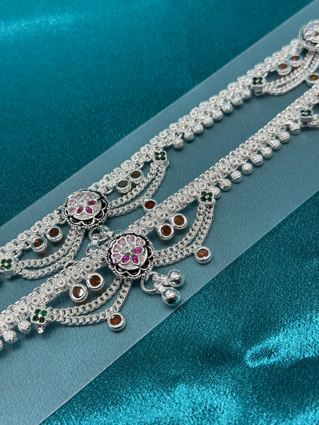 Traditional silver anklet with pink and orange stones and hanging bells