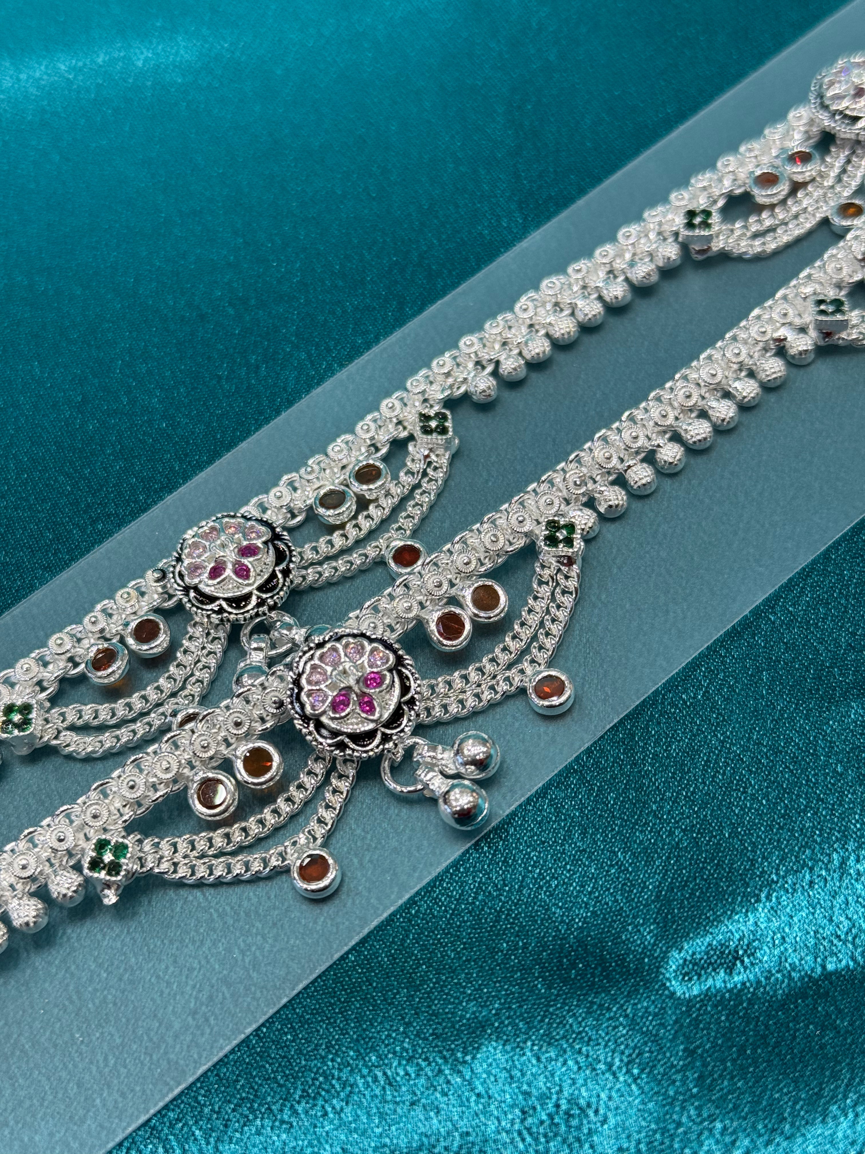 Traditional silver anklet with pink and orange stones and hanging bells