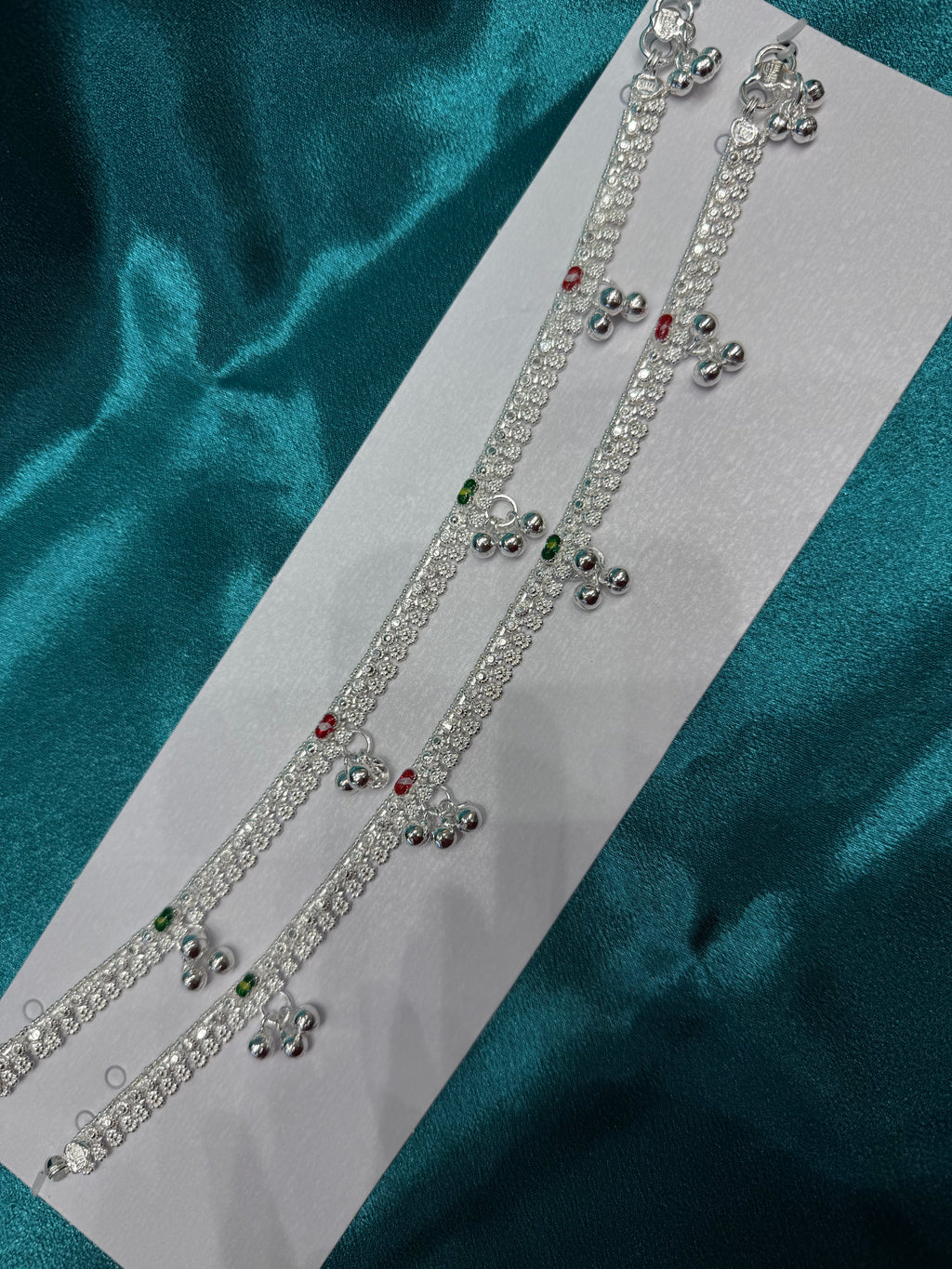 Traditional silver anklet with triple bells and red green pattern