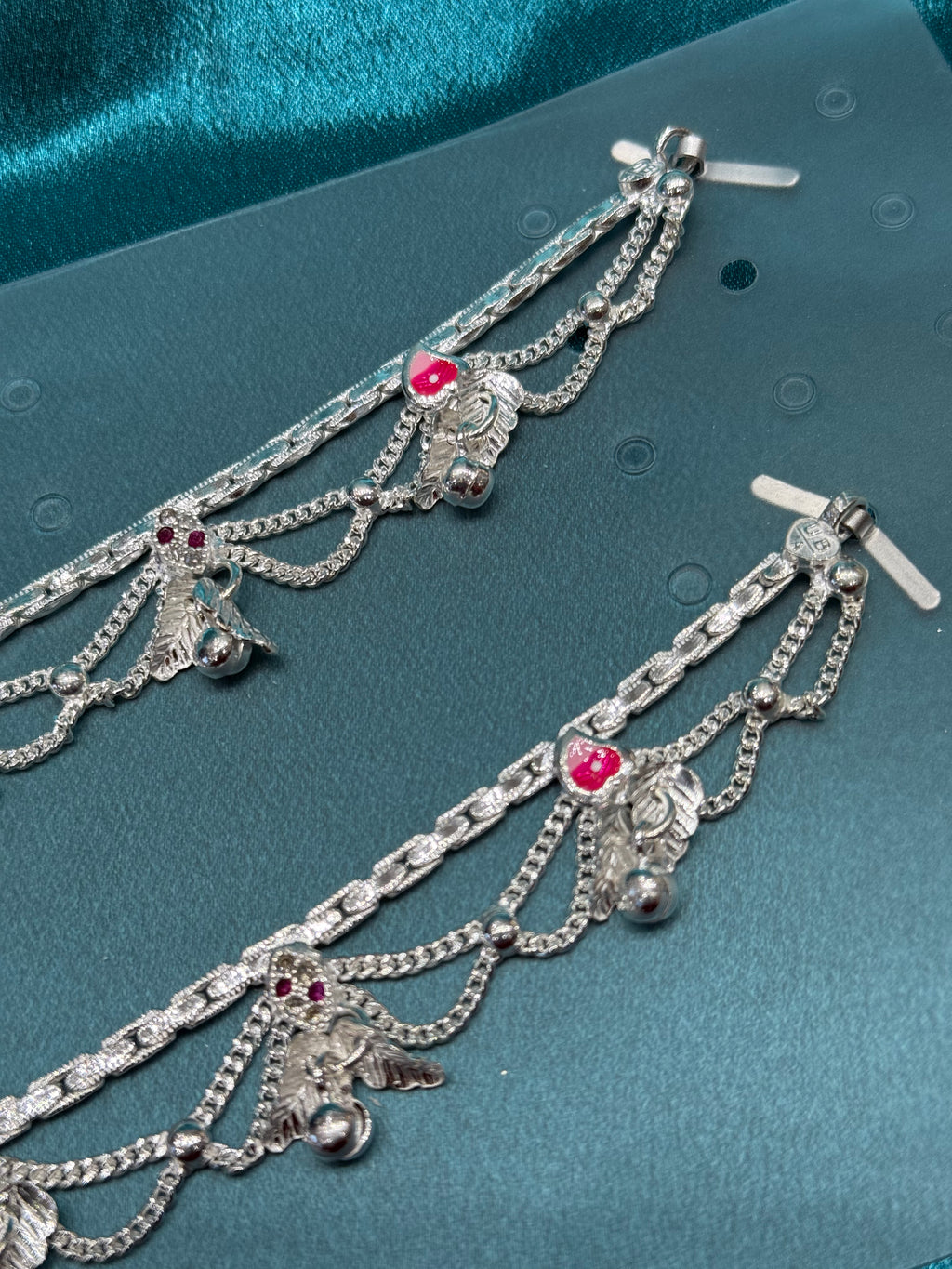 Traditional silver anklet with leaf and bell hanging