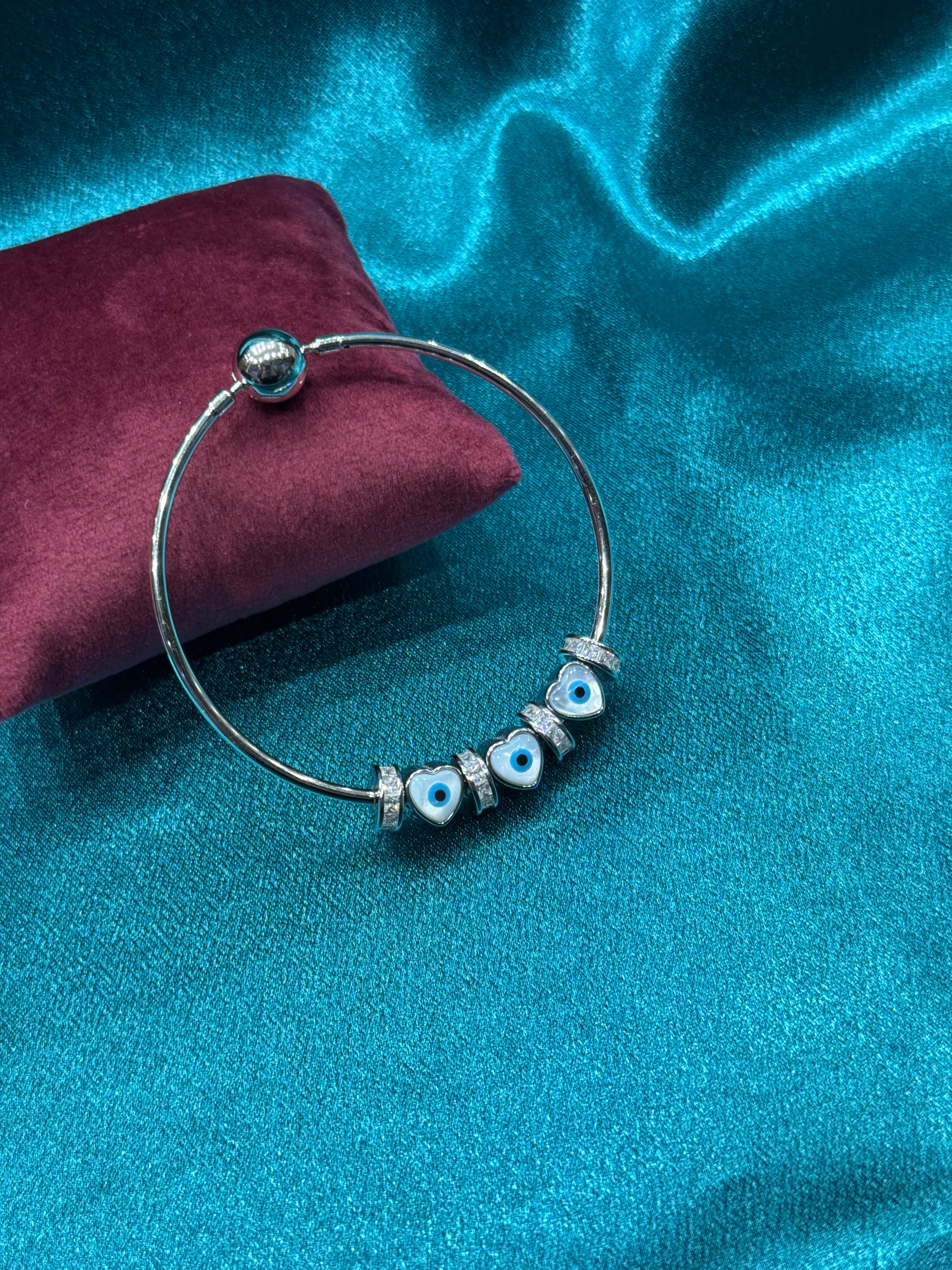 Fancy pandora style silver bracelet with heart shaped evil eye charms