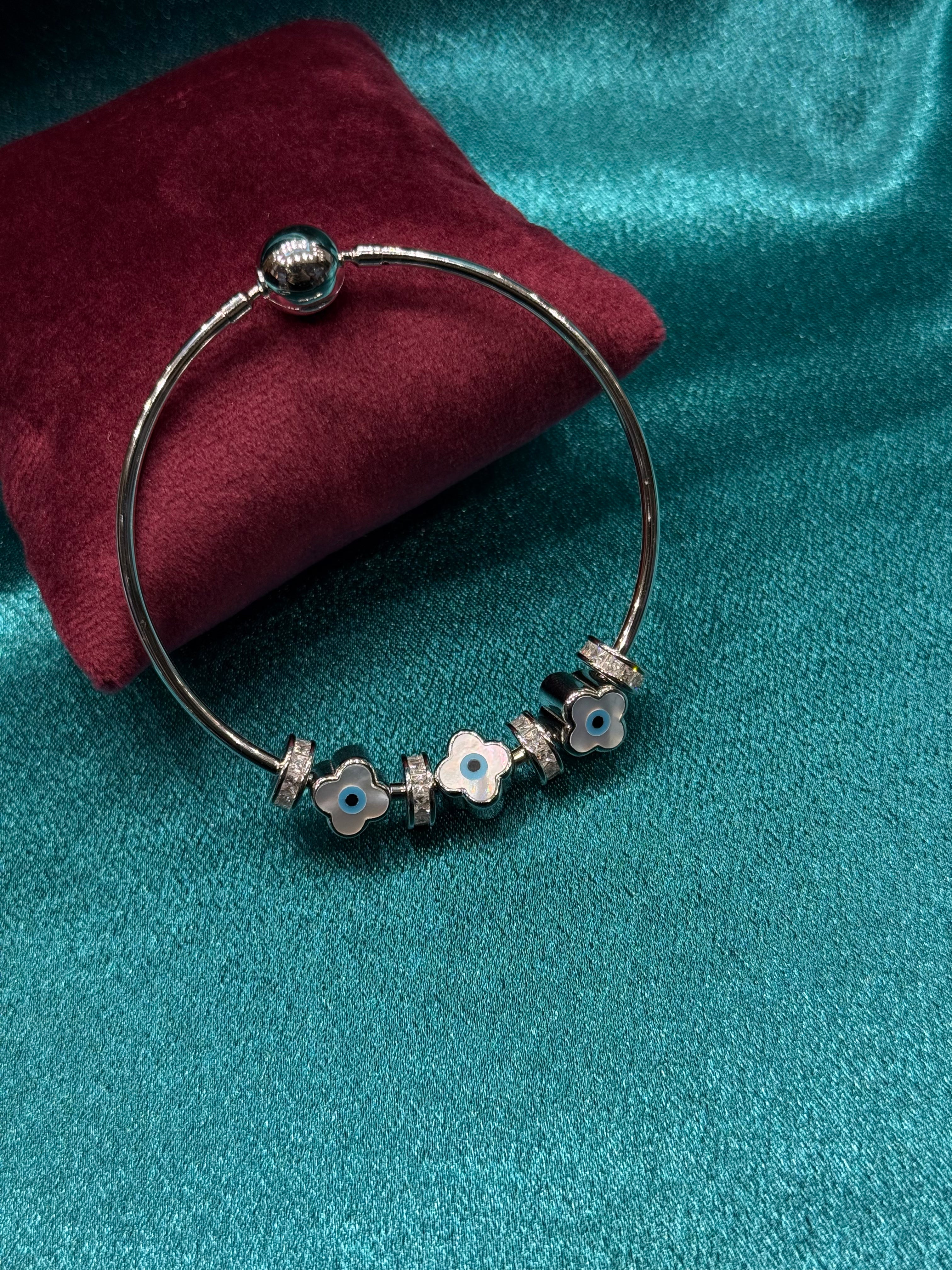 Fancy pandora style silver bracelet with evil eye charms