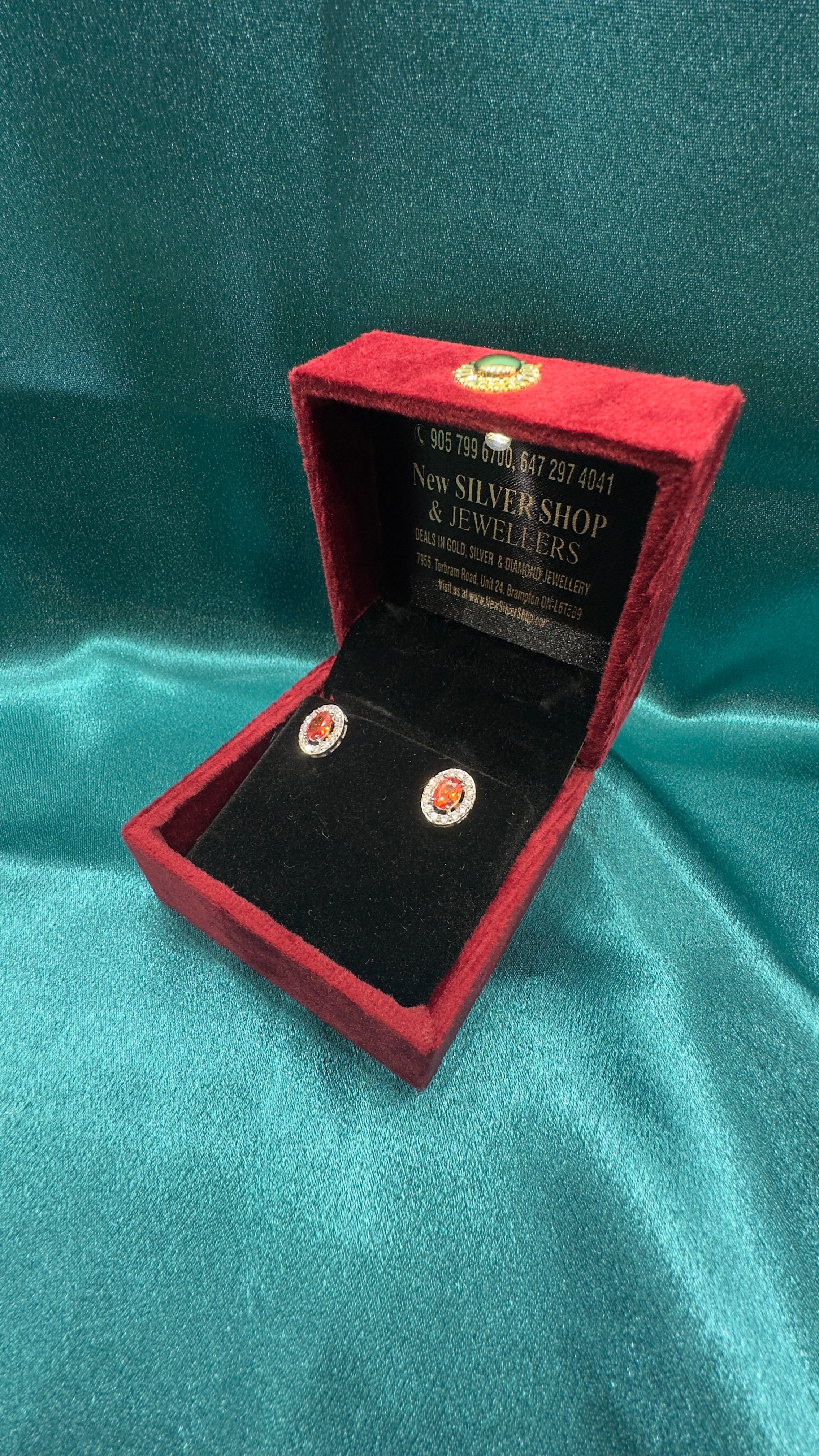 Silver earrings with orange cz diamonds and centre stone