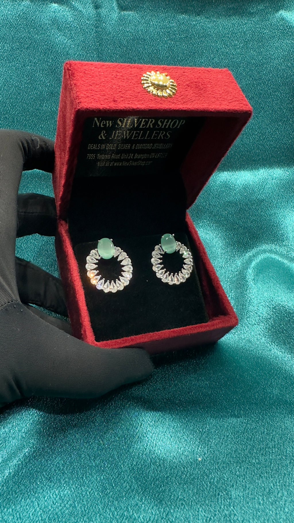 Silver earrings with pastel green cz diamond