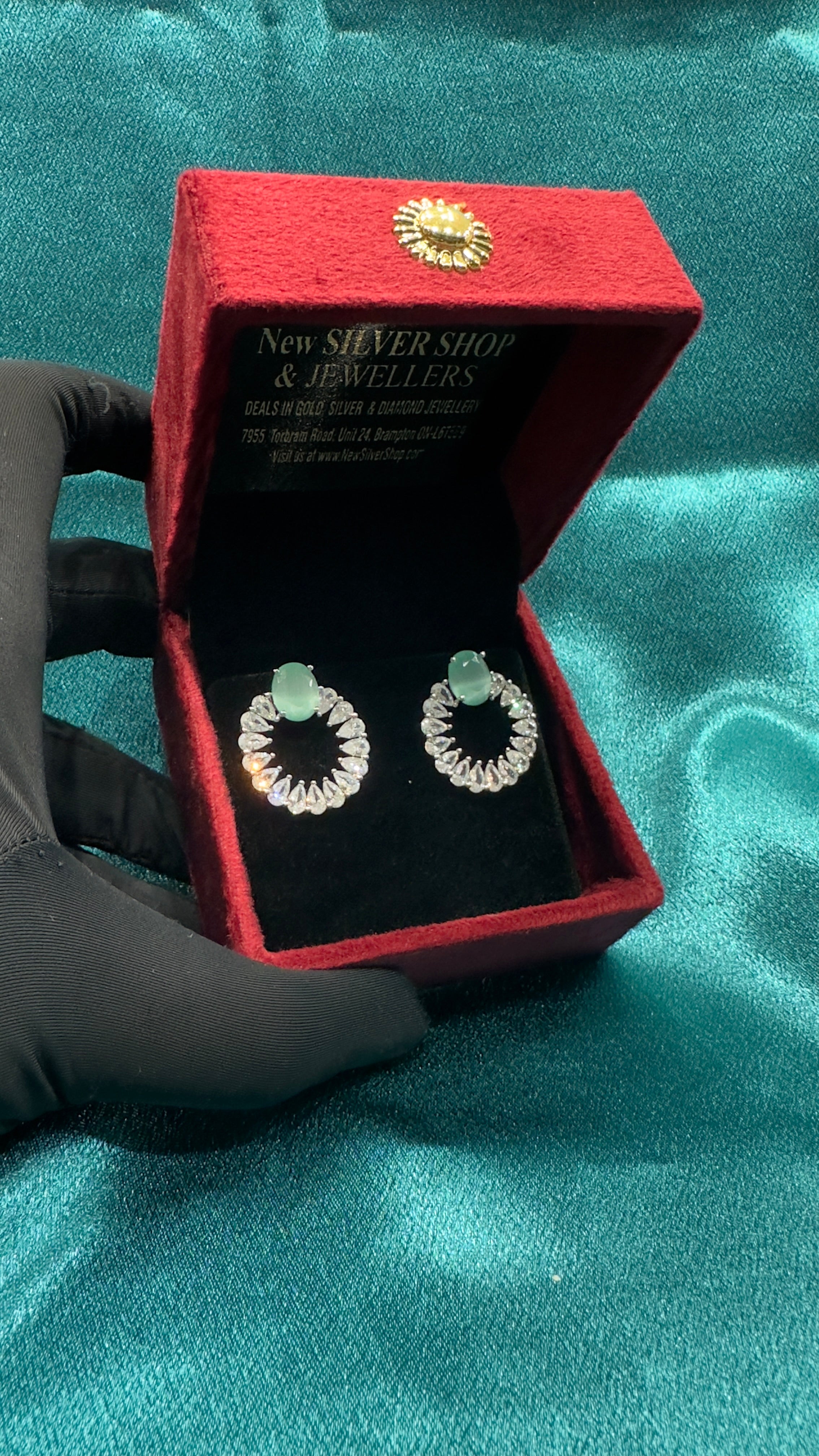 Silver earrings with pastel green cz diamond