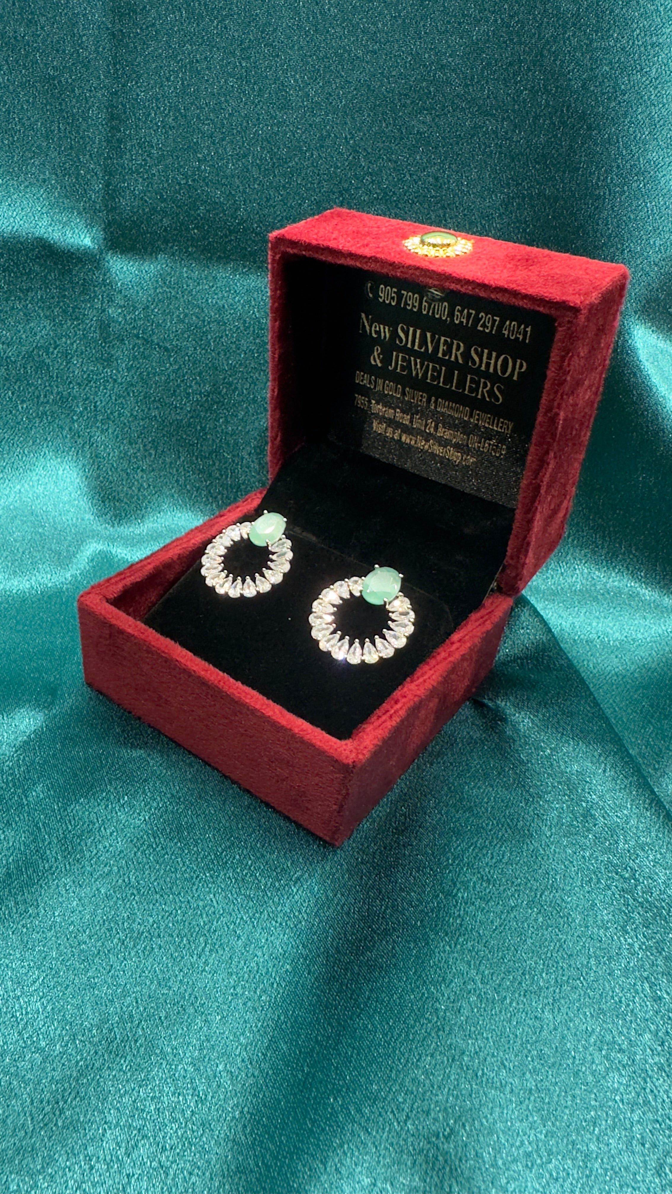 Silver earrings with pastel green cz diamond