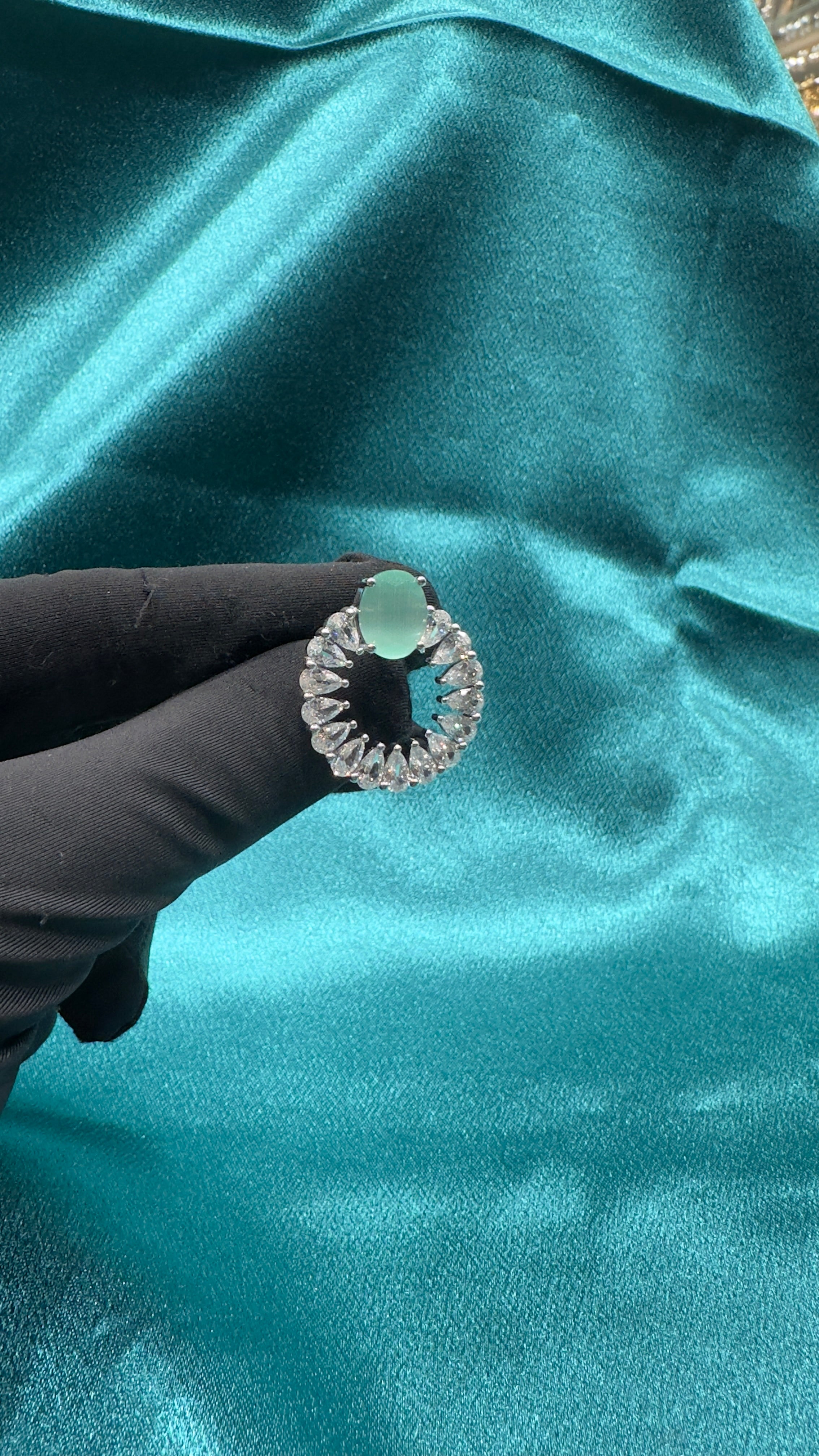 Silver earrings with pastel green cz diamond